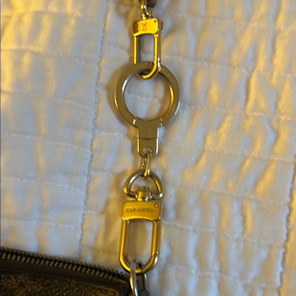 Louis Vuitton Golden Bolt Extender Keychain. Excellent condition.